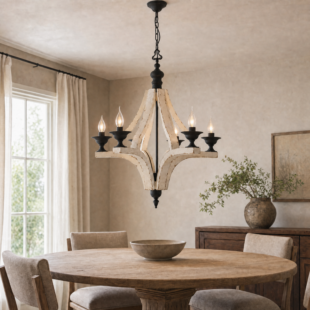 Six-light rustic wood chandelier illuminating a round oak dining table