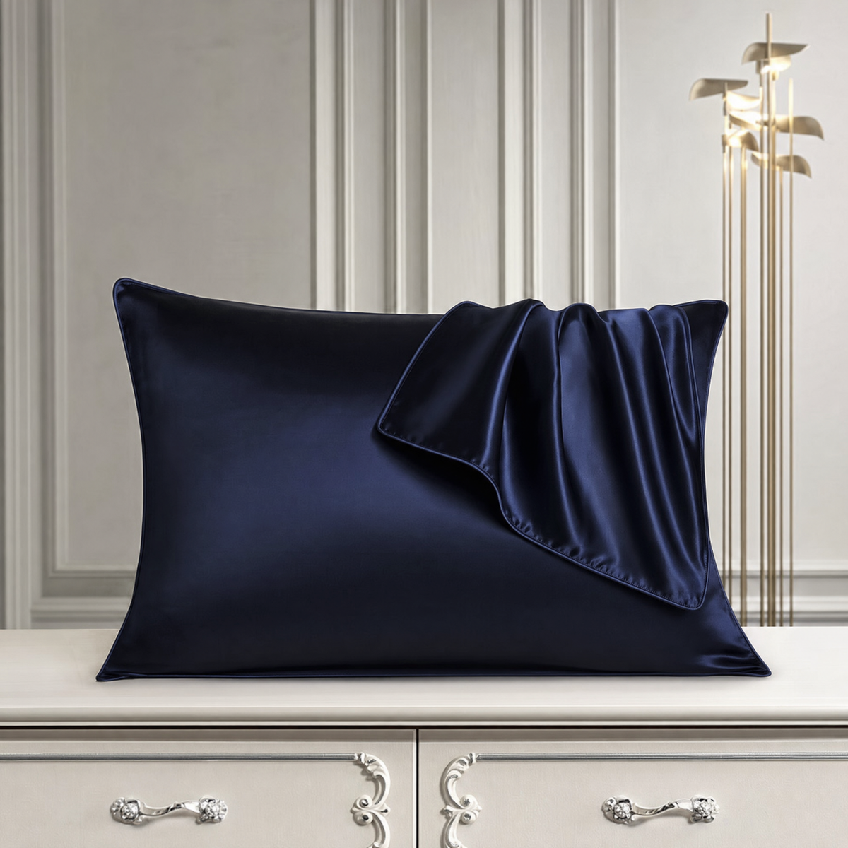 Mulberry silk pillowcase in Dark Blue, styled with a folded silk corner
