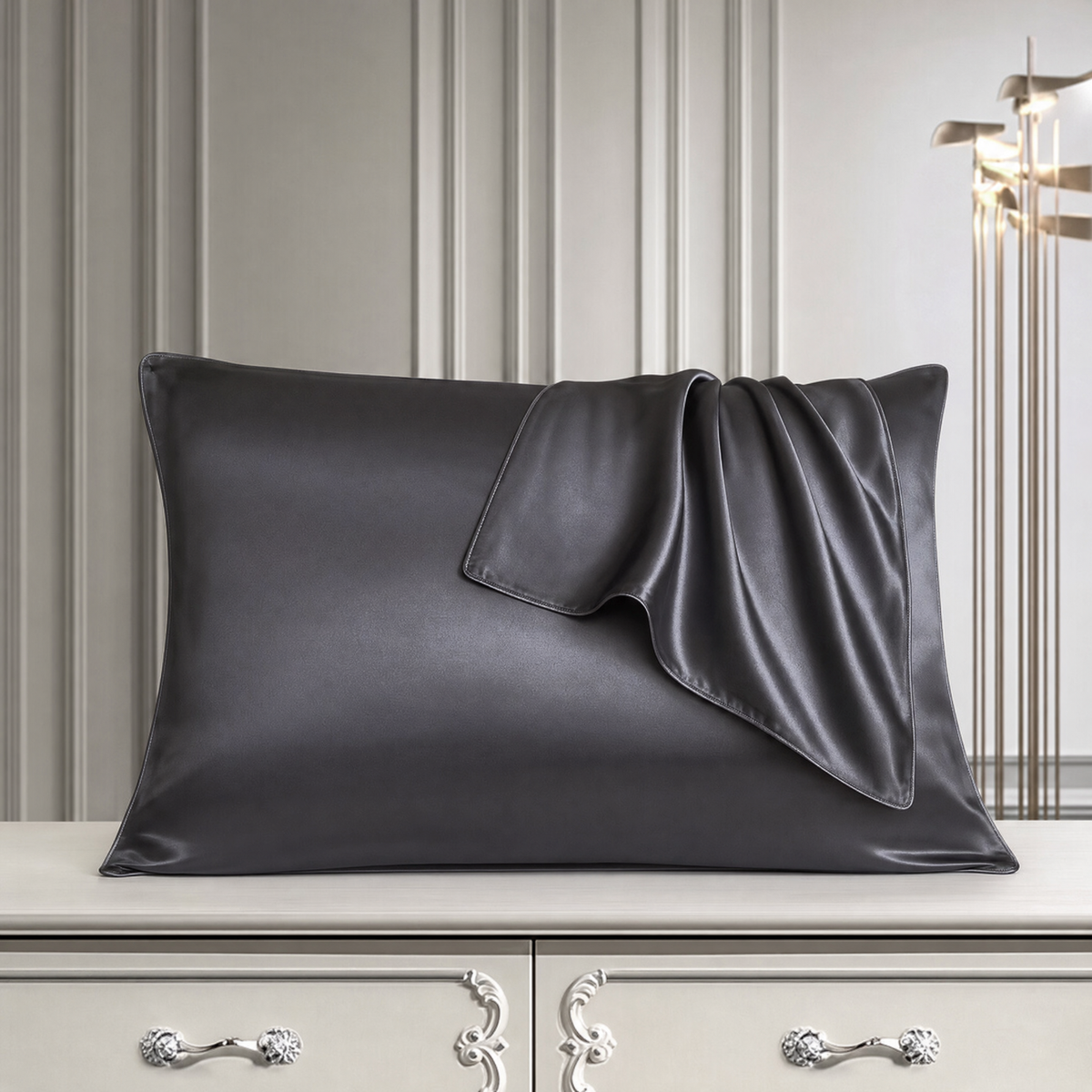 Mulberry silk pillowcase in Dark Gray, styled with a folded silk corner