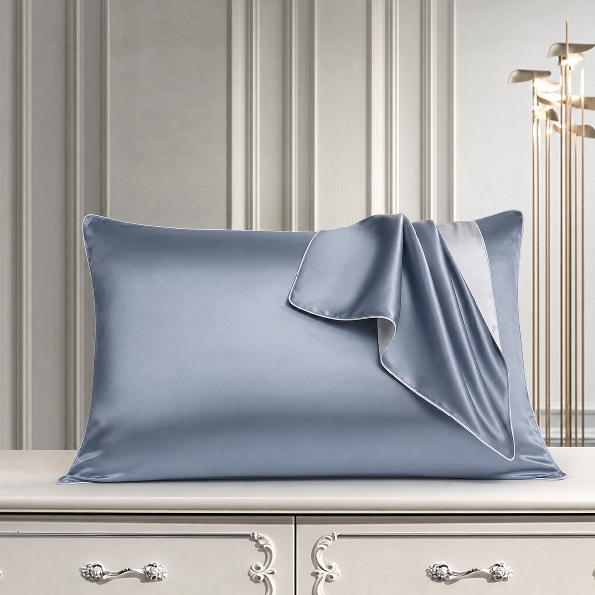 Mulberry silk pillowcase in Gray And Blue, styled with a folded silk corner