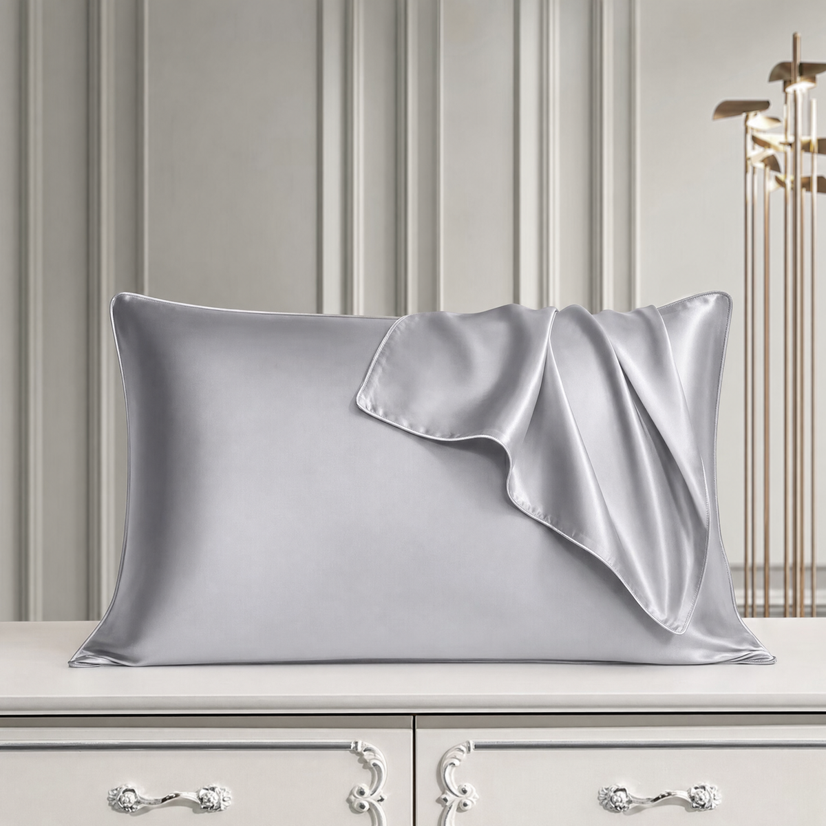 Mulberry silk pillowcase in Silver Gray, styled with a folded silk corner